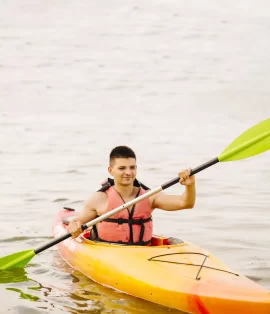 young-male-kayaker-kayaking-lake