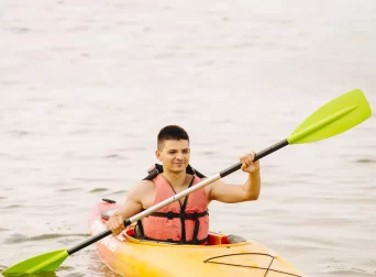 young-male-kayaker-kayaking-lake