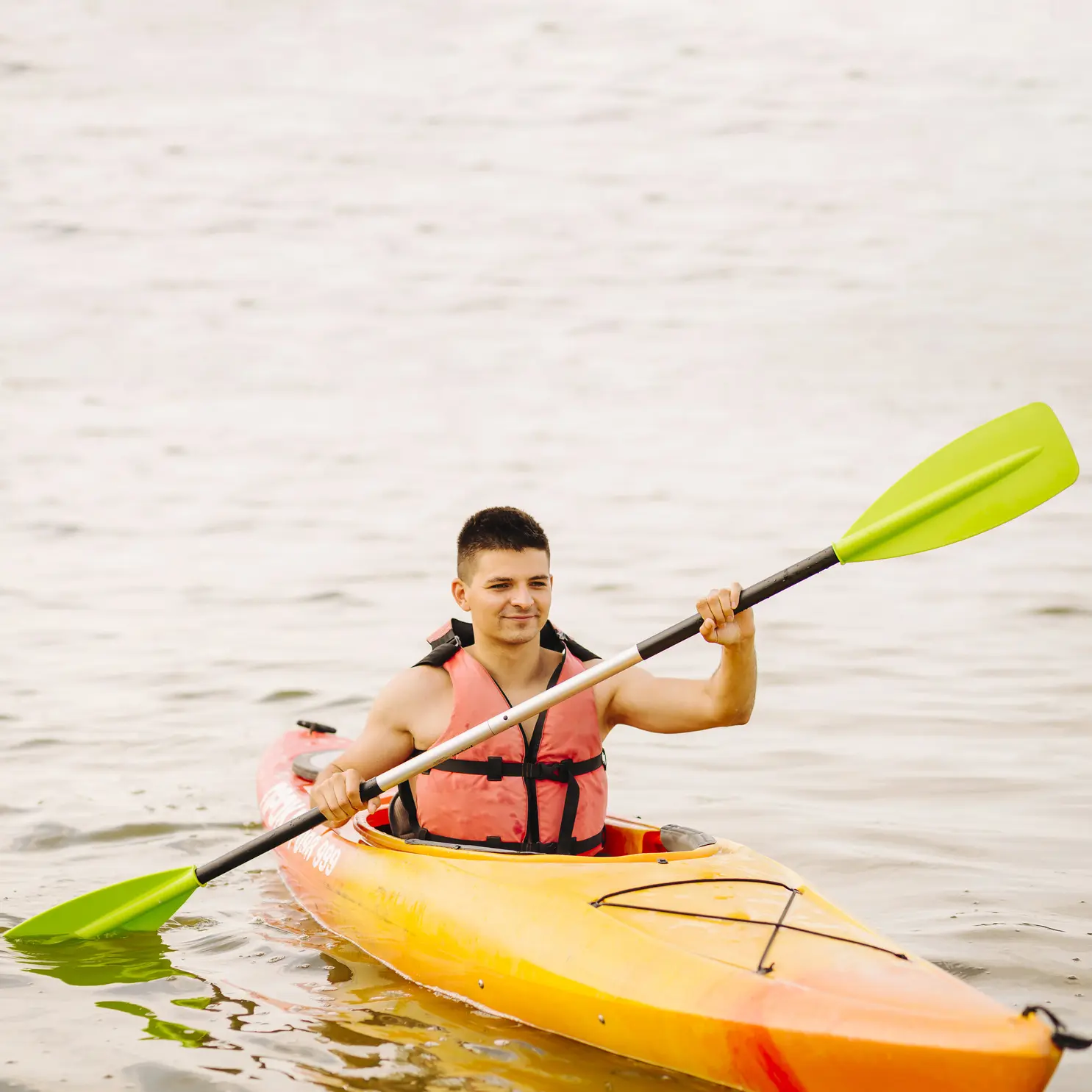 young-male-kayaker-kayaking-lake